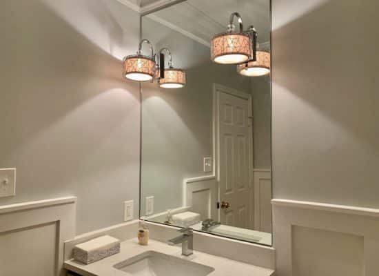 new sink and hovering light fixtures as part of a bathroom remodel in maryland