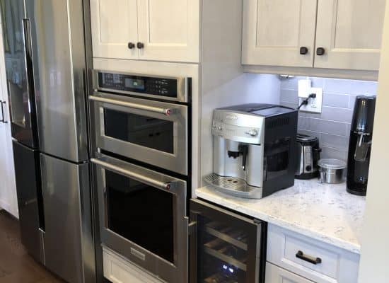 amazing kitchen makeover with in wall oven installation and beautiful new white countertops in maryland