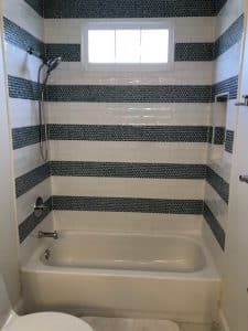 black and white striped tile tub install for bathroom makeover in maryland